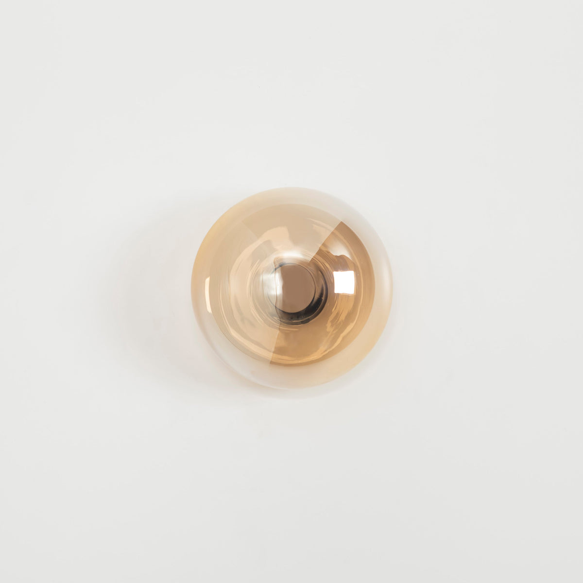 Gold-colored knob on a white background