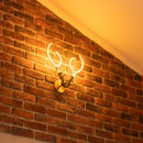 Decorative wall light fixture on a brick wall