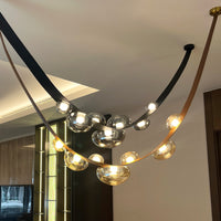 Modern chandelier with glass shades in a room setting