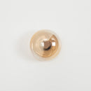 Gold-colored knob on a white background